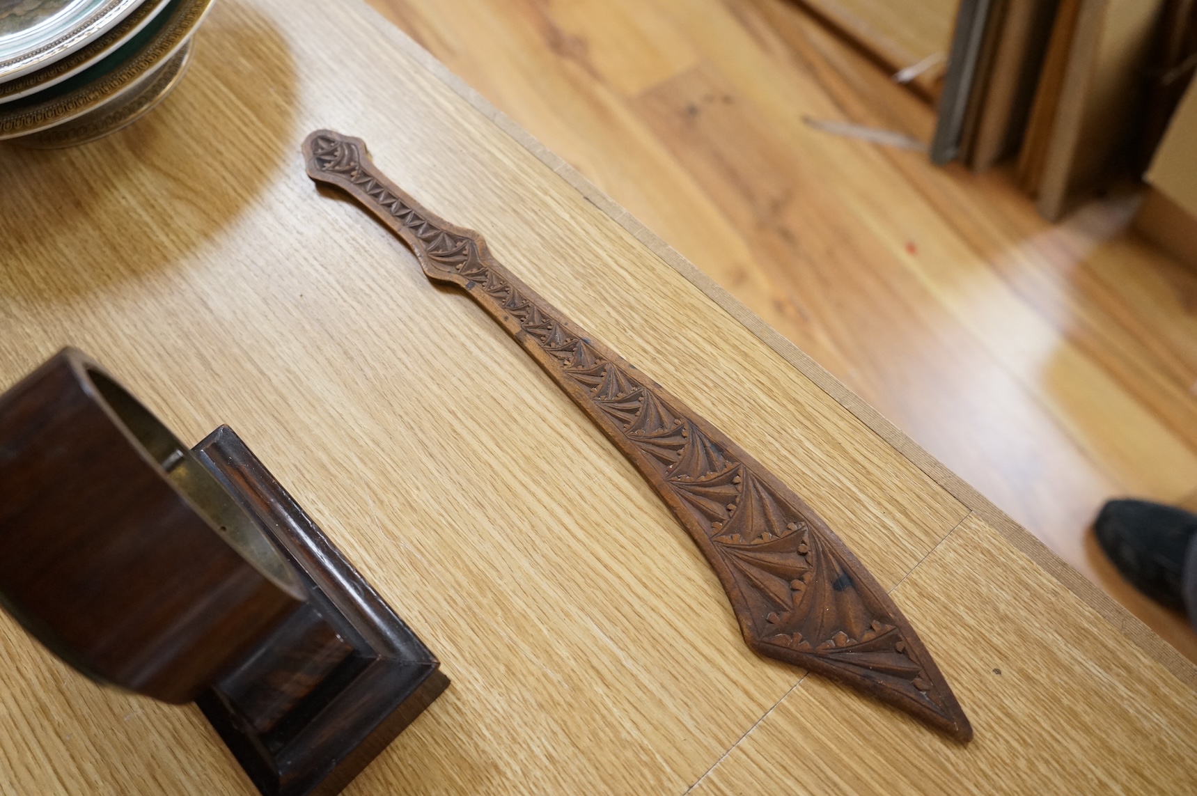 A 19th century rosewood and inlaid silk lined box, a small VAP timepiece and a carved page turner, largest 22cm wide